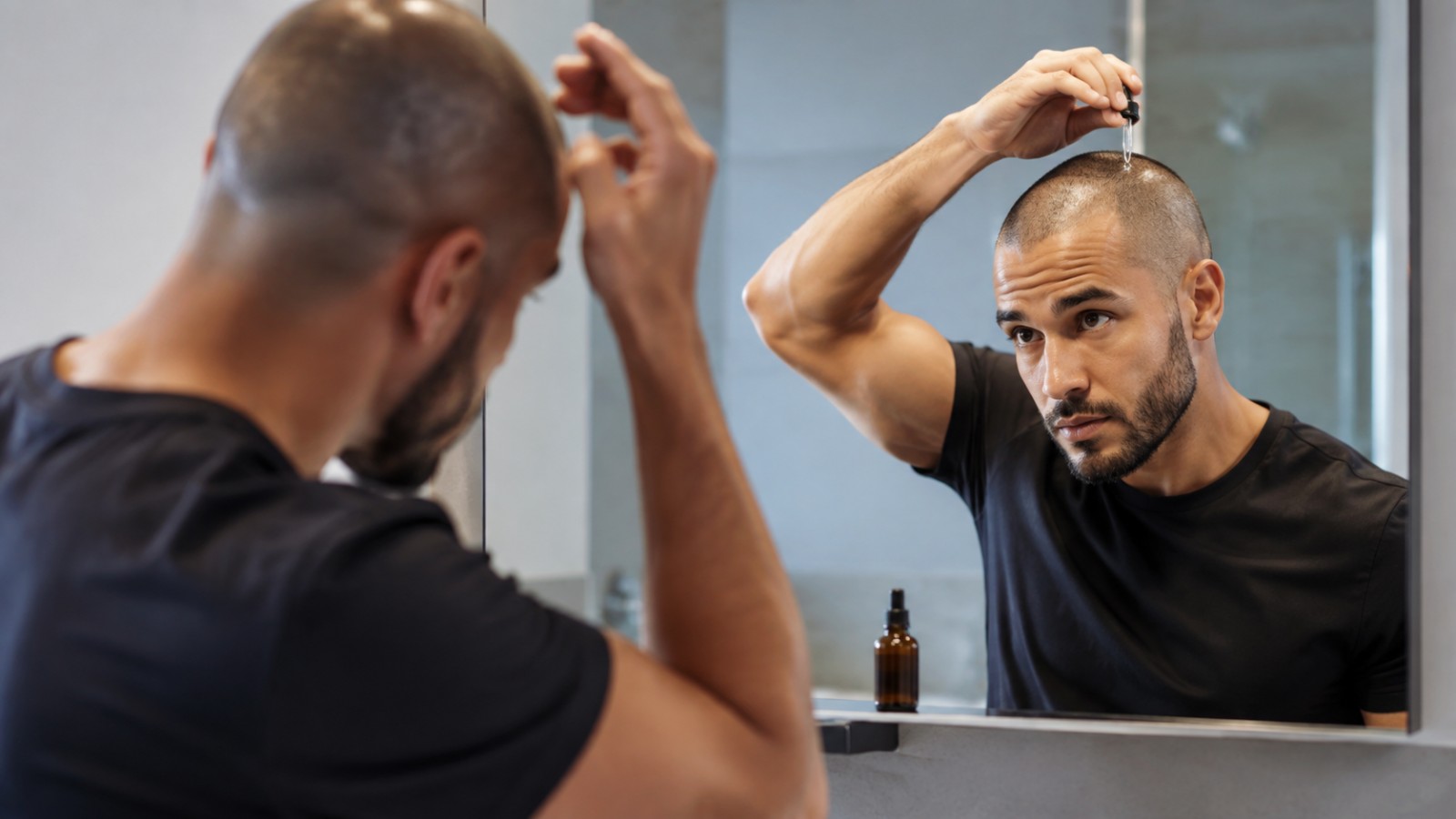 A chemical exfoliant applied with the fingertips keeps the follicles of a closely shaved scalp clear.