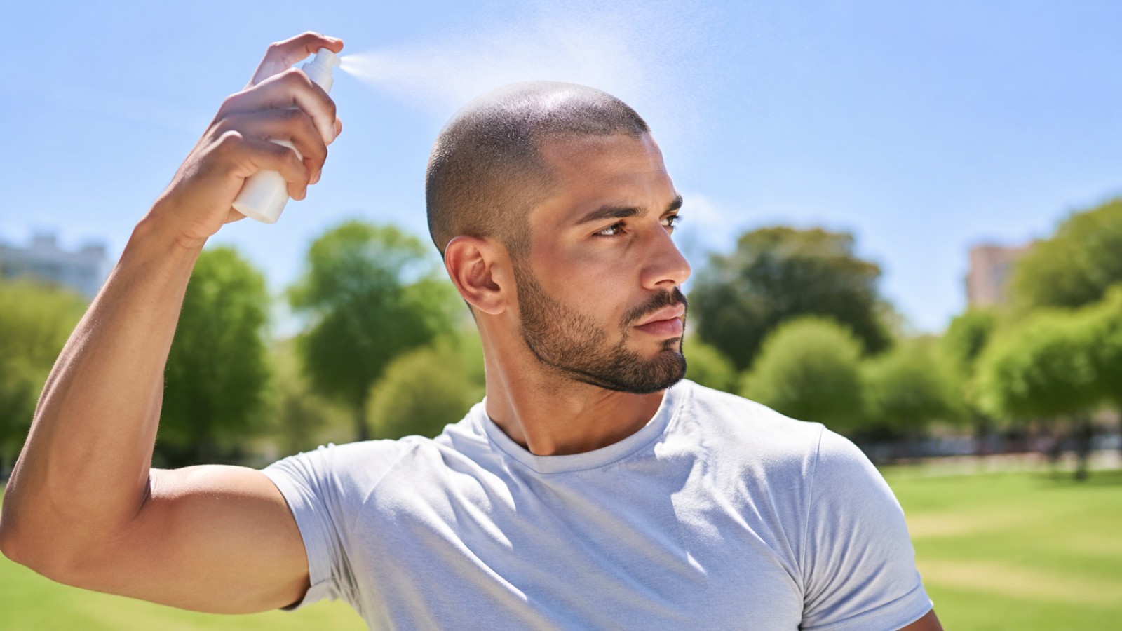 An invisible sunscreen spray makes reapplication easy without disturbing a freshly cut fade.