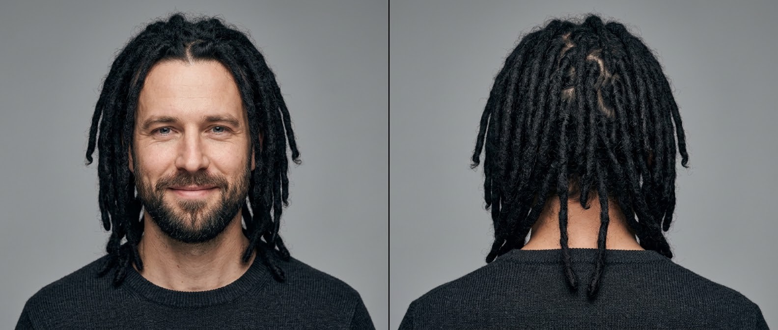 Caucasian man with long, black dreadlocks parted in the middle, paired with a short, neatly trimmed beard against a grey background.